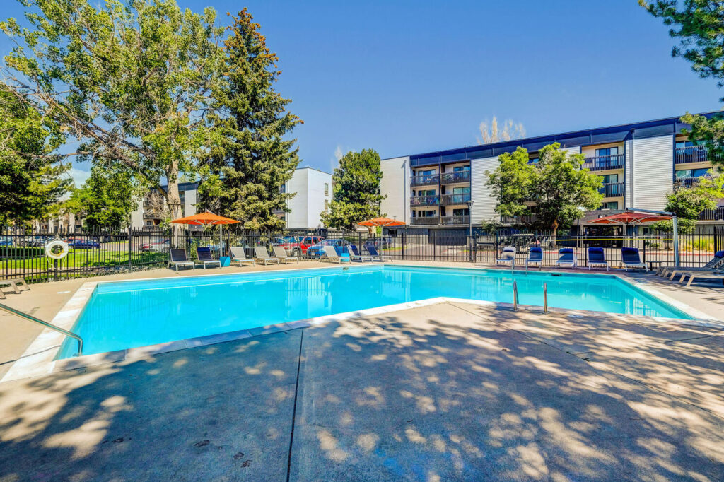 Relaxing pool area with loungers at Sage at Panorama dog-friendly apartments in Denver