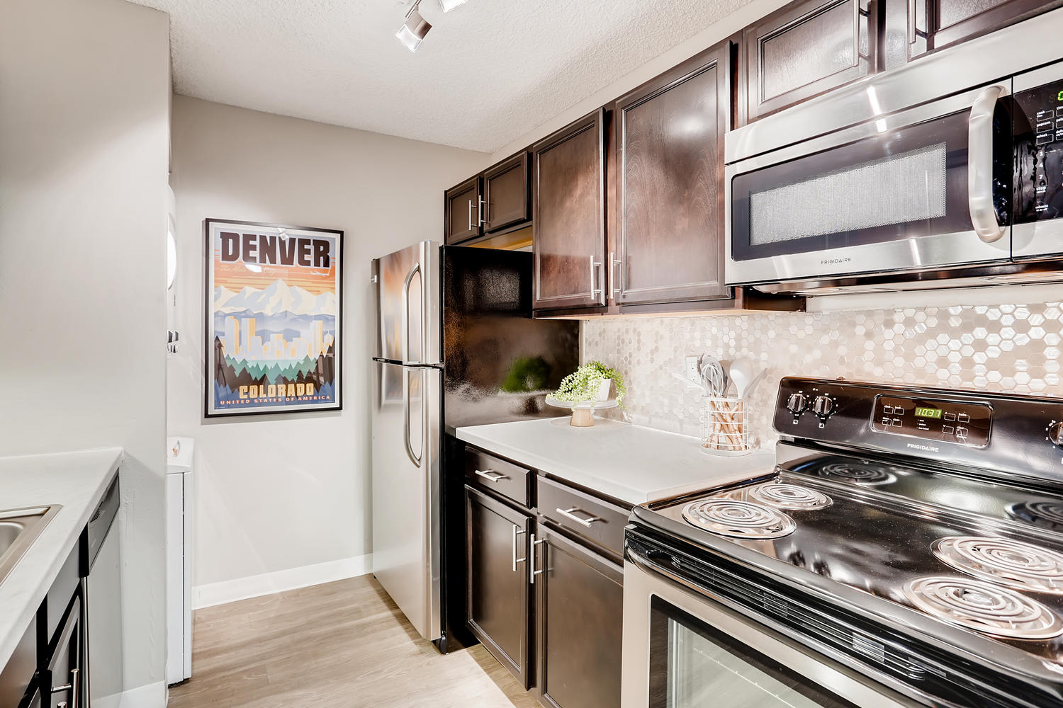 kitchen with appliances and dark cabinets