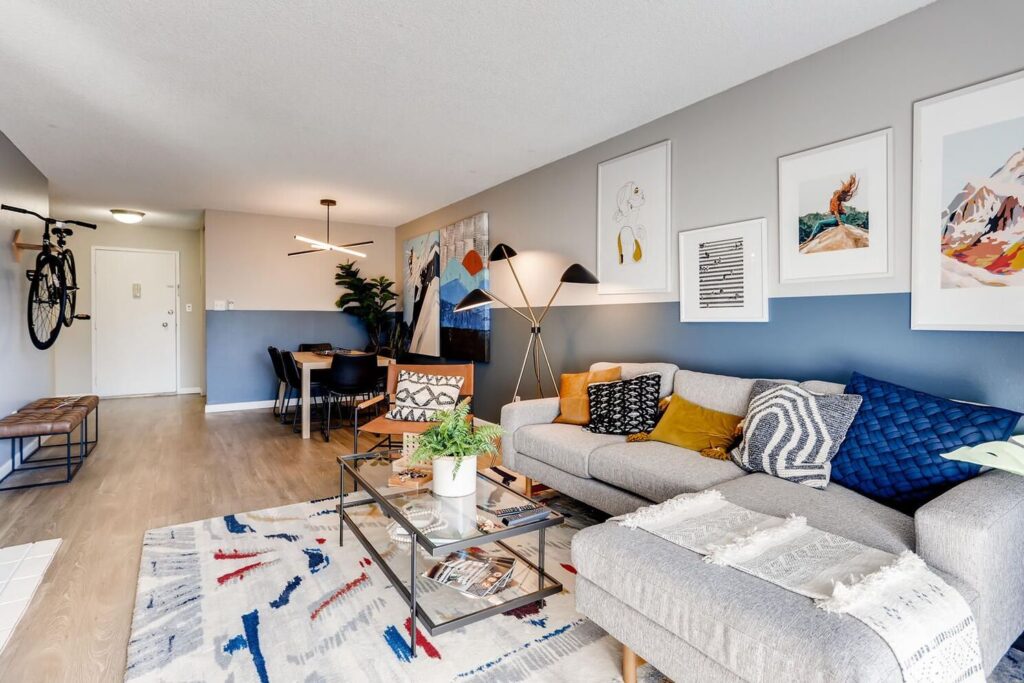 large living and dining space with decor and view of front door